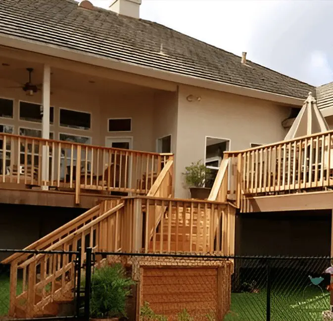 A large deck with stairs leading to the upper level.